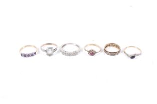 A group of six various gem set rings including four in 9ct gold.