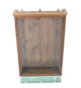 A pine and glazed collector's wall display cabinet. With nine glass shelves.