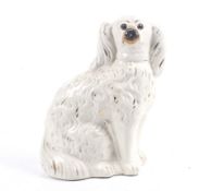 A 19th century Staffordshire pottery King Charles Spaniel ceramics dog.