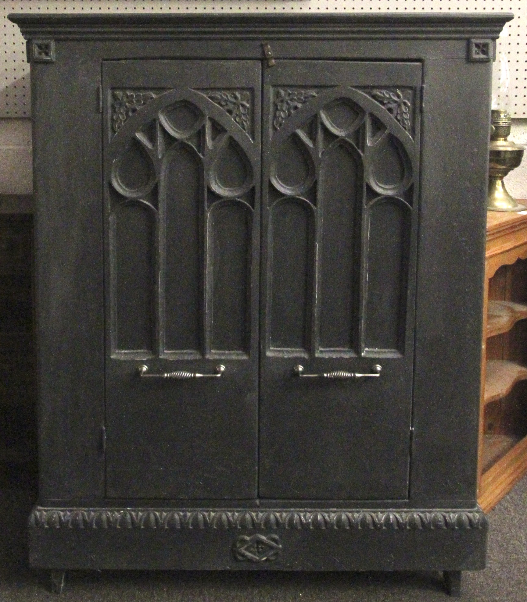 A Gothic style television cabinet.