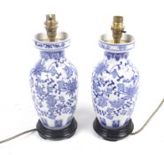 A pair of Chinese style blue and white ceramic table lamps.