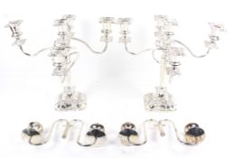 A pair of silver-plated four-branch/five-light candelabra.