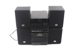 Two BUSH hi-fi systems with speakers.