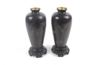 A pair of 20th century papier mache Japanese vases.