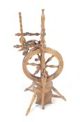 A vintage German wooden spinning wheel.