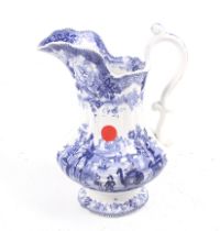 A 19th century ceramic jug. Transfer printed in a blue and white 'Oriental' pattern, marked 'W.C.