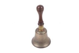 A vintage brass school bell. With a turned wooden handle, H24.