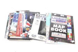 A collection of vintage Lombard rally books.