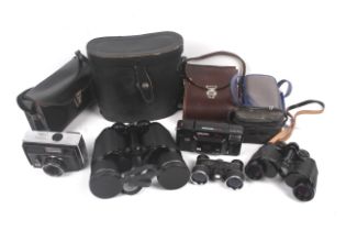 An assortment of vintage cameras and binoculars.