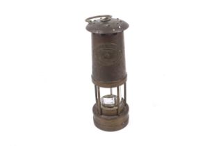 A late 20th century brass miner's safety lamp. Thomas & Williams Ltd, Cambrian, number 132180.