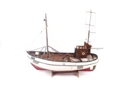 A 20th century handmade wooden model of a fishing trawler.