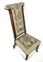 A Victorian high back prayer chair.