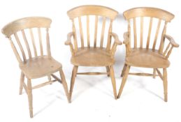 Three contemporary pine kitchen chairs.