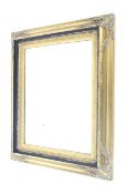 Gilt framed wall mirror. With bevelled edges, shell relief moulding decoration to each corner.