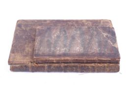 Two 18th century leather bound books.