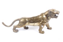 A large Japanese style weighted brass figure of a tiger.