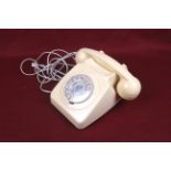 A vintage GPO 8746G Bakelite rotary dial telephone.
