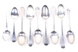 Nine various George II and later silver table and dessert spoons.