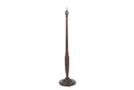A circa 1950s mahogany stained beech standard lamp.