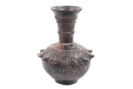 A probably Middle Eastern stoneware vase with bronze effect finish.