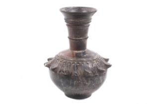 A probably Middle Eastern stoneware vase with bronze effect finish.