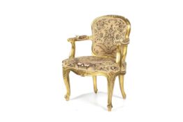 A 20th century gilt framed Louis XV style fauteuil chair.