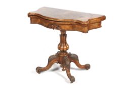 A Victorian serpentine fold-over pedestal burr walnut card table.