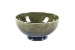 A small green glazed Moorcroft Columbine pattern bowl.