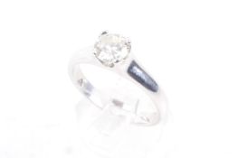 A modern platinum and diamond solitaire ring. The round brilliant approx. 0.