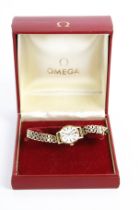 Omega, a lady's gold-plated and stainless steel wristwatch.