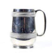 A Victorian silver pint mug.