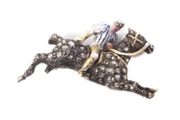 A late Victorian gold, diamond and enamel brooch in the form of a polo pony and rider.