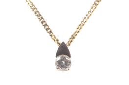 A vintage 9ct gold and diamond single stone pendant and chain. The round brilliant diamond approx.