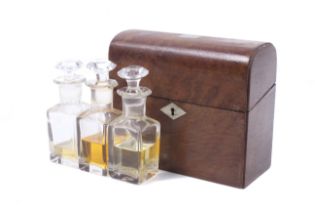 A 19th century bird's eye maple veneer three bottle perfume set.