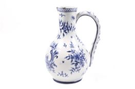 A late 18th/early 19th century Dutch Delft bottle shaped jug.