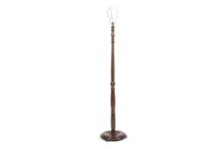 A 1930s/40s mahogany standard lamp with turned column on a round stepped base. H151cm.