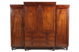An early 20th century mahogany breakfront triple wardrobe.