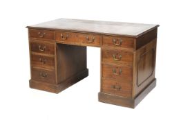 An early/mid-20th century Georgian style mahogany pedestal desk.