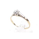 A vintage gold and diamond solitaire ring. The old cut stone approx. 0.