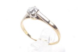 A vintage gold and diamond solitaire ring. The old cut stone approx. 0.