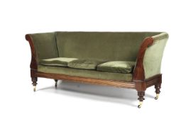 A late 19th/early 20th century mahogany sofa with green velvet upholstery.