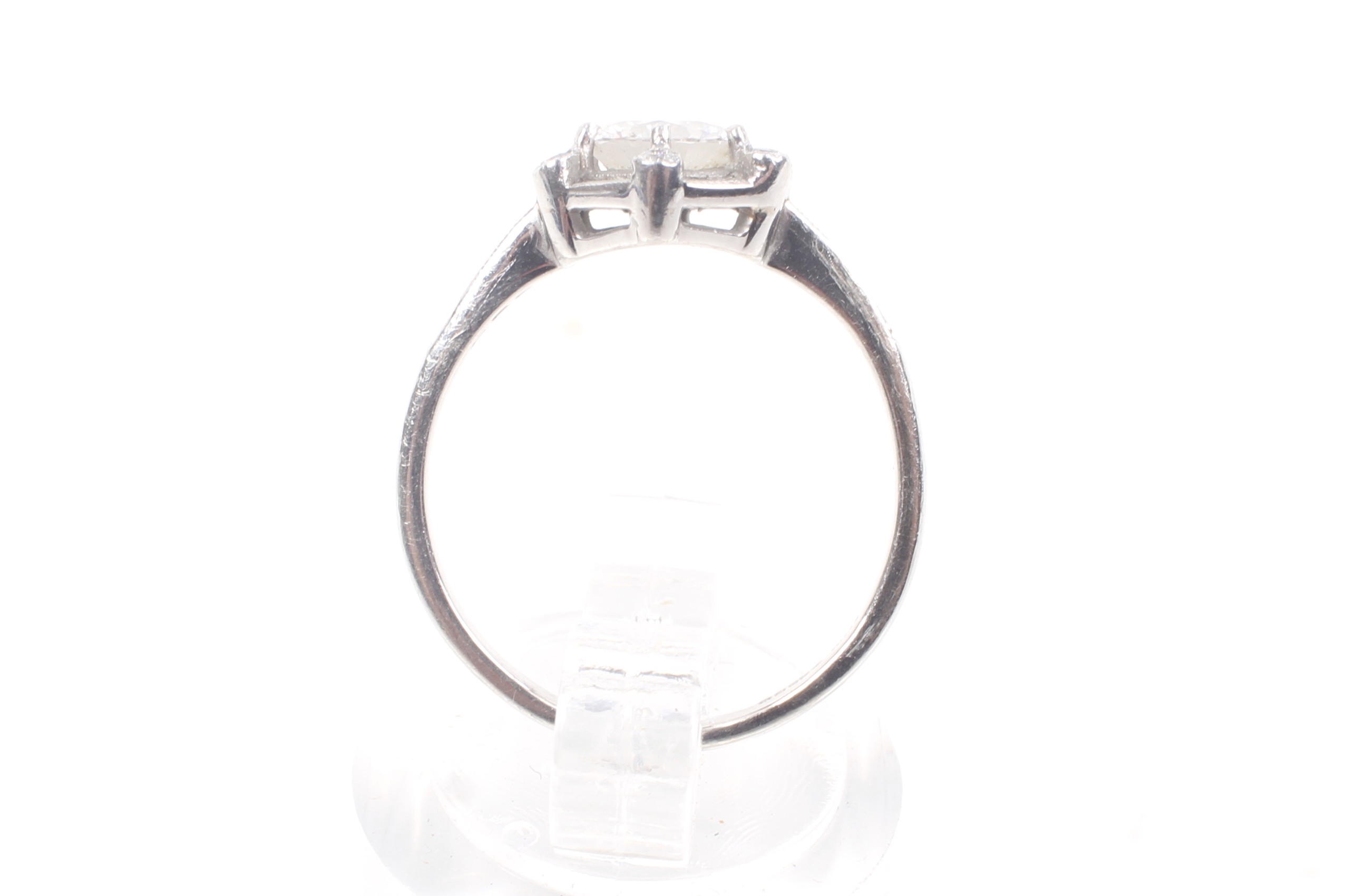 A modern platinum and diamond hexagonal cluster ring, circa 2007. - Image 3 of 12