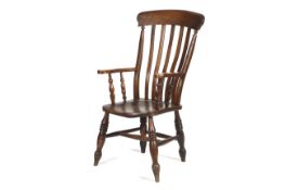 A Victorian elm seated and stained beech lathe back armchair. On turned supports and legs, H115.