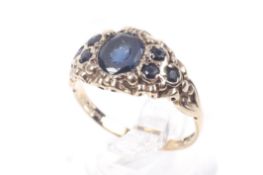 A vintage 9ct gold and very dark blue sapphire-coloured-stone dress ring.