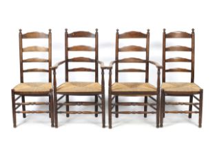 A set of four early 20th century ladder back chairs.
