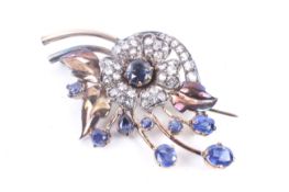 A mid 20th century gold and sapphire floral spray brooch.