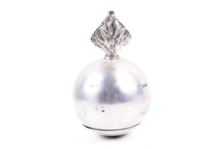 An Edwardian silver table lighter in the form of a 'flaming bomb' or grenade.