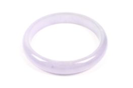 A jadeite slave bangle probably stained purple