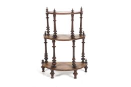 A Victorian three tier demi-lune What-not. With turned supports and finials, H93cm x W65.
