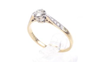 A vintage 18ct gold and diamond solitaire ring. The round brilliant approx. 0.